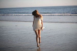 girl in white dress beach